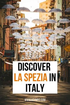 an image of umbrellas hanging in the air with text overlay that reads, discovering la spezia in italy