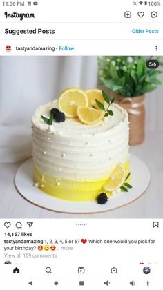 the cake is decorated with lemons and blackberries