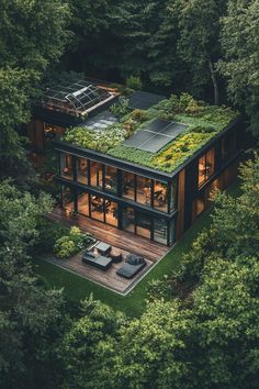 23 Stunning Eco Houses Offering Off-Grid Living Garden House Architecture, Barndominium With Solar Panels, Modern House With Greenhouse, Off Grid Garden Ideas, Modern Forest House Floor Plans, House With Atrium In The Middle, Roof Garden Ideas Modern, Modern Greenhouse Attached To House, Japanese Inspired House Exterior