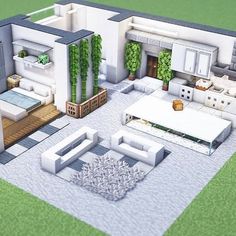 an aerial view of a modern house with white furniture and green plants on the roof