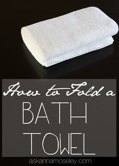 there is a towel on the table with words above it that read how to fold a bath towel