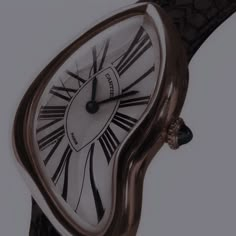 an elegant watch with roman numerals on the face