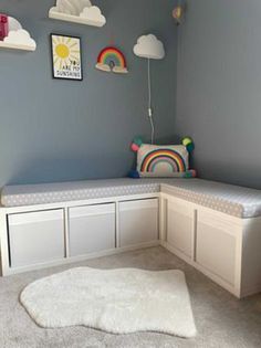 a child's room with blue walls and white carpeted flooring is shown