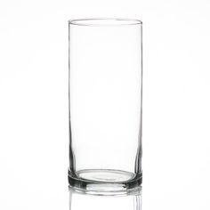 a tall glass filled with water sitting on top of a table