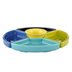 three bowls are stacked on top of each other, one is blue and the other is yellow