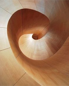 the inside of a wooden spiral staircase