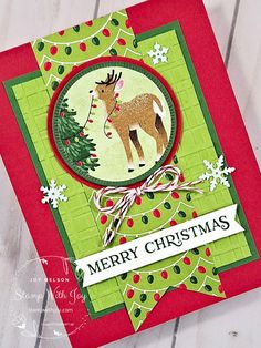 a christmas card with a deer and tree