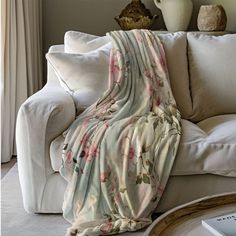 a blanket draped over a couch in a living room