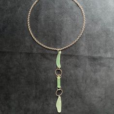 Statement necklace of genuine sea foam coloured sea glass collected in Sydney Harbour and hand-drilled and set on a silver-tone waterproof steel chain.  Absolutely stunning with a strapless top or dress or peeking out from a collared top. The steel chain is waterproof and fits over the head at approximately 63 cm long. The pendant portion of the necklace hangs at approximately 18cm from the chain.  I am happy to adjust the chain length to your specifications and include a clasp. Please message m Sydney Harbour, Collared Top, Sea Glass Pendant, Vintage Bottles, Old Bottles, Beach Combing, Wedding Jewellery Necklace, Packing Material, Steel Chain