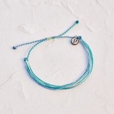 It’s the bracelet that started it all. Each one is handmade, waterproof and totally unique— in fact, the more you wear it, the cooler it looks. Grab yours today to feel the Pura Vida vibes. Vida Blue, Summer Necessities, Preppy Jewelry, Pura Vida Bracelets, Jewelry Accessories Ideas, Blue Topaz Earrings, Topaz Earrings, Pretty Bracelets, White Sand Beach