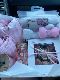 an open car trunk filled with stuffed animals and other things to put in the back seat