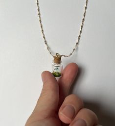 Handmade mushroom terrarium necklace or ornament. Item is made with preserved natural materials, glass, and polymer clay.  The cork at the top is glued in and should not be removed as the items inside will remain the same for many years.  However, if left out in direct sunlight some changes in color may appear.  Chain is stainless steel and can be made with gold or silver. 17" Chain  Item is made to order.  Please indicate if you would like a gold or silver chain. If you would like to change the Mushroom Terrarium, Tiny Terrarium, Tiny Mushroom, Terrarium Necklace, Left Out, Polymer Clay Crafts, Handmade Polymer Clay, Clay Crafts, Natural Materials