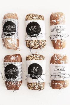 six loaves breads with labels on them