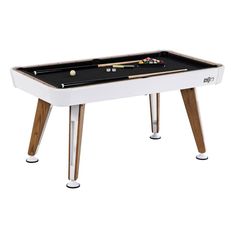 a pool table with two cues and balls on it