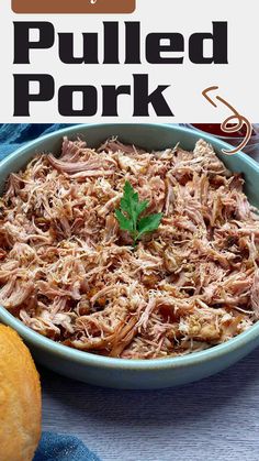 pulled pork in a blue dish with parsley garnish on top and text overlay that says pulled pork