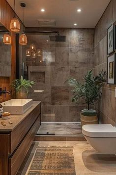 a bathroom with two sinks, a toilet and a bathtub next to each other