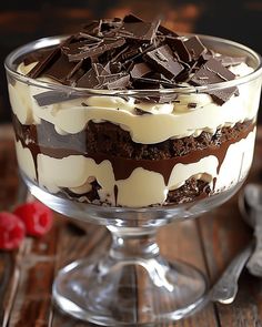 a dessert dish with chocolate and cream toppings