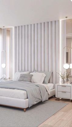 a large white bed sitting in a bedroom next to a tall wall with vertical blinds