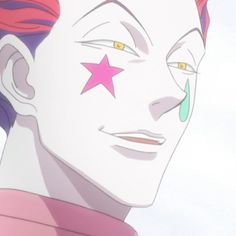 a close up of a person with pink hair and green eyes wearing a star on his forehead