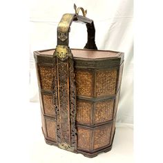 an old wooden box with ornate carvings on the front and sides, sitting against a white background