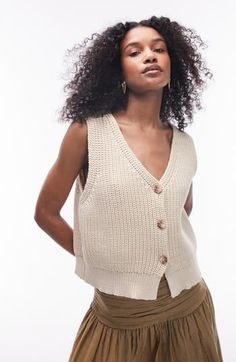 Combine sweater season with a summery day in a shaker-stitch vest knit from a cotton-enriched blend. 19" length (size medium) Front button closure V-neck 64% cotton, 36% nylon Machine wash, dry flat Imported