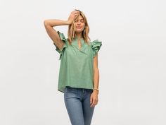 GREEN SOLID Our playful Flutter Sleeve top perfect for warmer weather in vibrant green cotton voile. Casual Cotton Flutter Sleeve Tops, Casual Cotton Tops With Flutter Sleeves, Green Relaxed Fit V-neck Blouse, Summer Relaxed Fit Flutter Sleeve Tops, Green Relaxed Fit V-neck Top, Spring Ruffle Sleeve Top With Relaxed Fit, Spring Relaxed Fit Tops With Ruffle Sleeve, Relaxed Fit Flutter Sleeve Tops For Spring, Relaxed Fit Ruffle Sleeve Tops For Spring