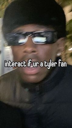 a man wearing sunglasses and a hat with the words interact if ur a tyler fan