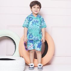 Stylish Abstract Design: - This set features a coordinated design with a matching shirt and shorts, creating a fashionable and put-together look for boys. - The tropical design ensures a hassle-free outfit choice and saves time when getting dressed. .Sales Package:- 1 Shirt & 1 Short  .Style:- Co-ord Set for kids Cotton Fabric: - Boys Co-Ord Set is crafted from cotton fabric, known for its softness, durability, and breathability. - Fabric provides a comfortable wearing experience, allowing for u Cotton Playwear Sets For Beach Season, Casual Short Sleeve Playwear Set, Blue Cotton Beach Season Sets, Casual Summer Short Set For Playwear, Summer Short Set For Vacation, Green Short Sleeve Short Set For Summer, Summer Playwear Shirt With Short Sleeves, Summer Short Sleeve Playwear Shirt, Summer Playwear Short Set