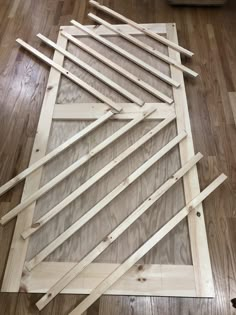 several pieces of wood sitting on top of a hard wood floor