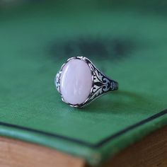 14 x 10mm cabochon on an antiqued sterling silver plated or brass adjustable ring.  Easy to adjust to any size. Choose from Rose Quartz, Amethyst or Rhodonite. Adjustable Vintage Cabochon Moonstone Ring, Vintage Adjustable Ring With Natural Stones, Vintage Adjustable Oval Moonstone Ring, Vintage Oval Crystal Ring With Natural Stones, Vintage Oval Moonstone Ring With Natural Stones, Adjustable Vintage Sterling Silver Crystal Ring, Vintage Adjustable Nickel-free Crystal Ring, Vintage Moonstone Ring With Large Stone For Gift, Vintage Moonstone Ring With Large Stone As Gift