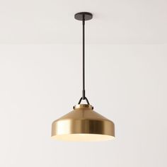 a light fixture hanging from the ceiling in a room with white walls and flooring