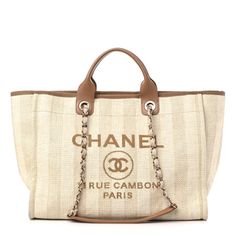 This is an authentic CHANEL Mixed Fibers Striped Medium Deauville Tote in Beige. This lovely woven tote is crafted of fine raffia with an iconic Chanel logo in brown. The bag features canvas threaded gold chain shoulder straps, brown leather handles, canvas trim, and an open-top. The brown fabric interior features zipper and patch pockets. Brown Bags With Embroidered Logo For Shopping, Designer Brown Bags With Embroidered Logo, Chanel Tote Bag, Green Tote Bag, Green Tote, Chanel Tote, Chanel Shoulder Bag, Chanel Logo, Chanel Paris