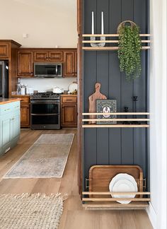 Kitchen modern shiplap plate rack satin black Behr paint early American stain Kitchen End Cap Ideas, Wasted Space In Kitchen, Wall Mounted Ledges Kitchen, Classy Farmhouse Decor, Arizona Room, Friend House, Modern Plates, Counter Desk, Narrow Kitchen