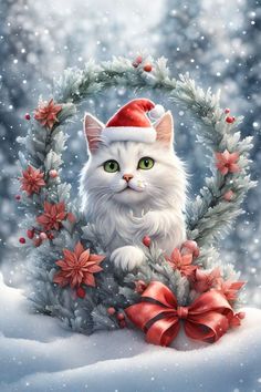 a white cat wearing a santa hat sitting on top of a snow covered ground next to a wreath