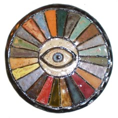 an eye is shown in the center of this decorative object