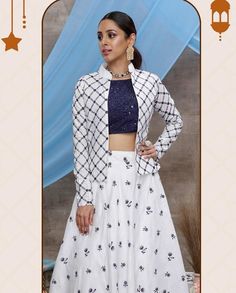 Here Is A Rich And Elegant Looking Lehenga Choli Which Comes With A Jacket. Its Attractive Blouse Is In Navy Blue Colour Paired With White Colored Lehenga And Jacket. This Whole Pair Of Lehenga, Choli And Jacket Are Cotton Based, Beautified With Pretty Work. #white#lahnga#whitelahnga#black#stylish#fashion#red#newyear#2022#newyearspecial2022#blue#bluewhite#ring#jacket#cotton#beautiful Indo Western Lehenga, Western Lehenga, Ring Jacket, Navy Blue Colour, Color Pairing