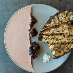 a white plate topped with two slices of cake