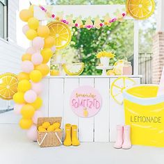 a lemon themed birthday party with yellow and pink decorations