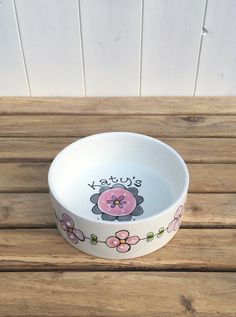 a white bowl with flowers painted on it