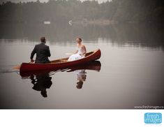 a bride and groom in a canoe on the water