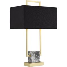 a table lamp with a black shade on the top and a gold frame around it