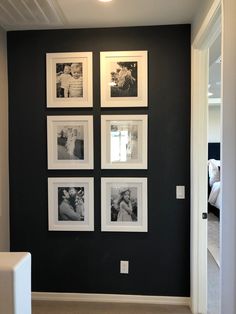 black and white photos are hung on the wall