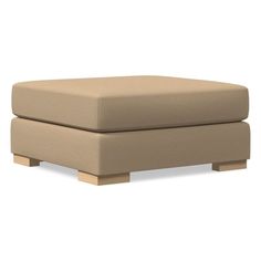 a beige ottoman with wooden legs on a white background