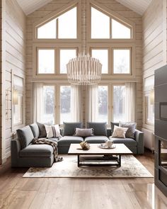 a living room filled with furniture and a chandelier hanging from the ceiling in front of large windows