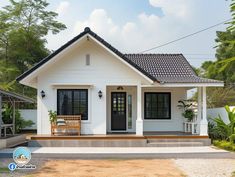 a small white house with black doors and windows