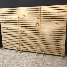 several wooden slats are lined up against the wall