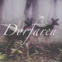 blurry photograph of deer in front of trees with the word dorffaren on it