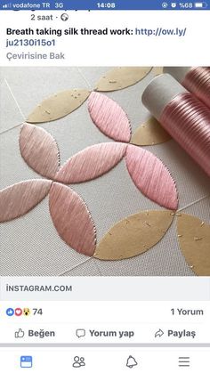 an instagram page with pink and gold circles on the bottom right corner, along with a roll of thread