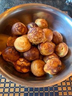 a bowl filled with lots of food on top of a table