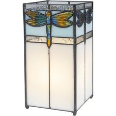 a stained glass lamp with dragonflys on it